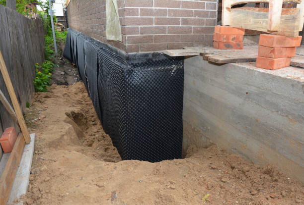 Happy homeowners after waterproofing job in Blissfield
